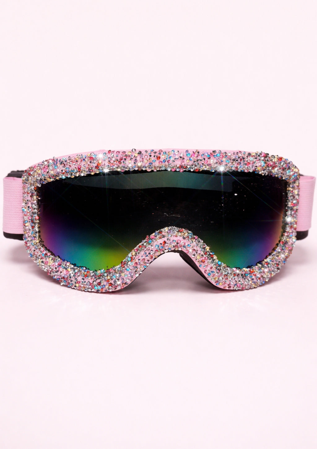 Sparkly goggles with pink frame and multicolored lenses on a white background