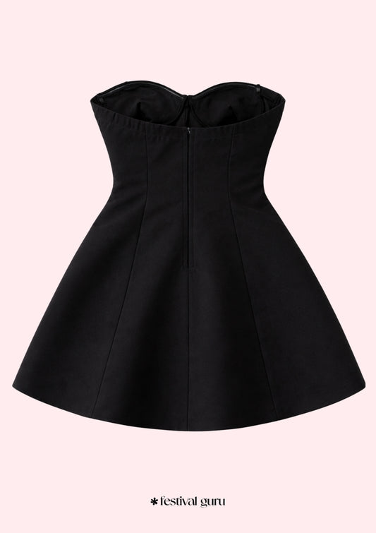 Black strapless dress on a light pink background with 'festival guru' branding.