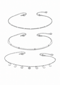 Заредете изображението в програмата за преглед на галерия, Three silver-toned delicate chain necklaces with different bead and disc charm designs, arranged vertically on a plain white background.

