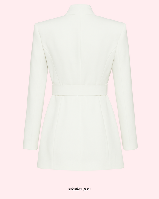 White blazer with pink accents on a light pink background