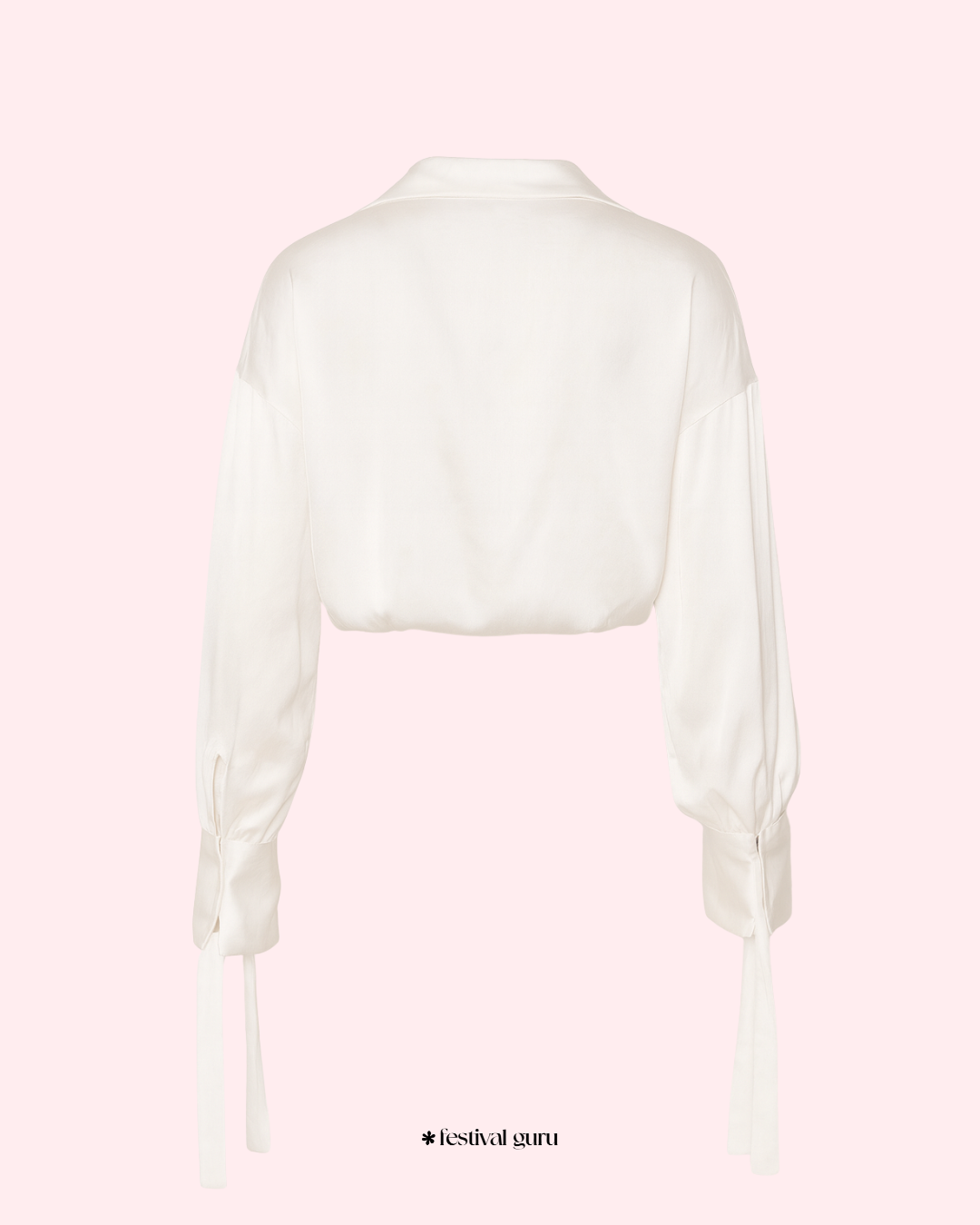White blouse with sheer sleeves on a light pink background