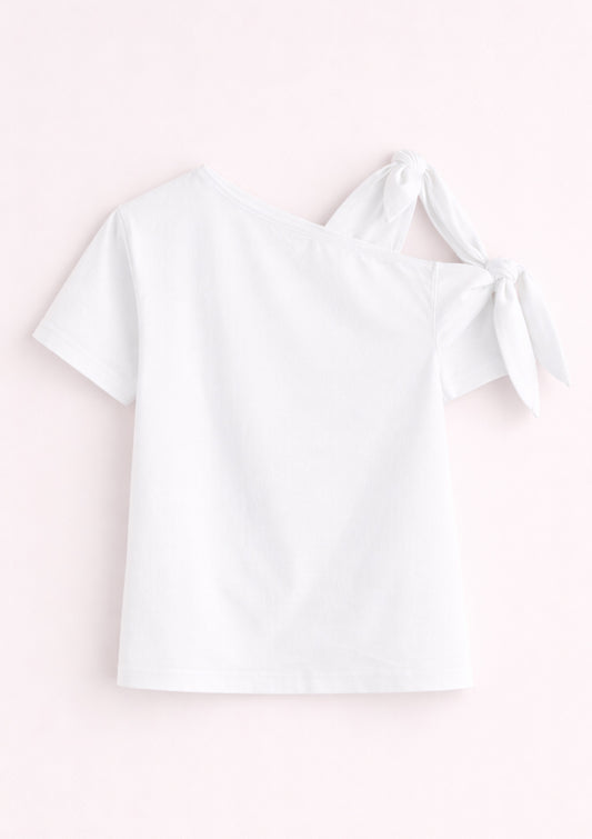 White blouse with a bow on a light pink background