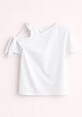 White off-shoulder top on a light pink background