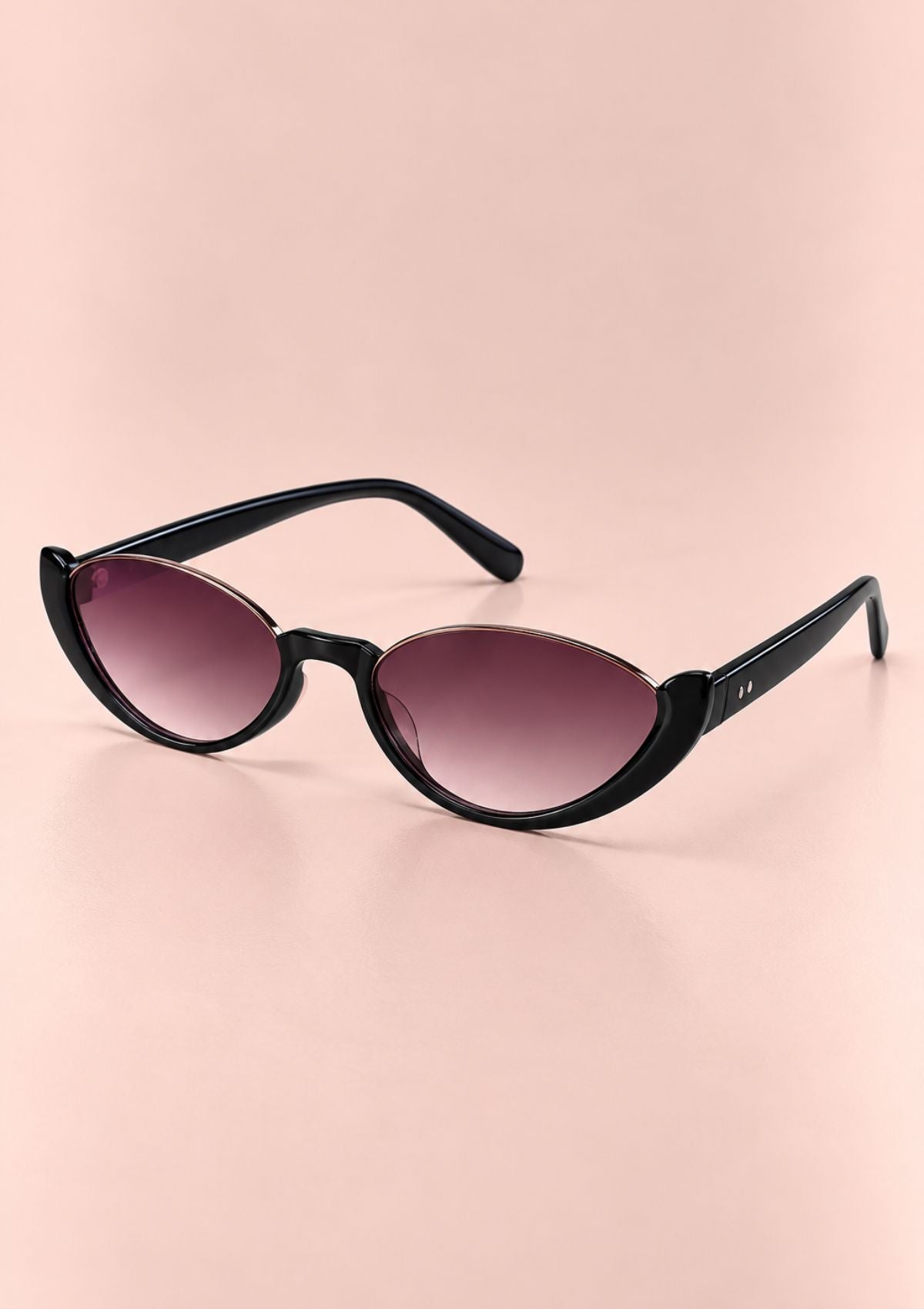 Green translucent square sunglasses with pink tinted lenses, displayed on a solid pale peach background.