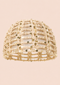 Load image into Gallery viewer, A beige crochet openwork hat embellished with small gold sequins, shown against a solid pale pink background.
