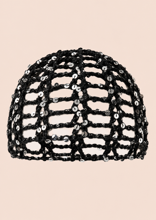 A black sequined mesh dome hat with an open lattice pattern, shown against a solid pale peach background.