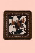 Заредете изображението в програмата за преглед на галерия, A square fringed scarf with a brown and black cow print center and a dark brown border with geometric patterns, displayed flat against a solid pink background.
