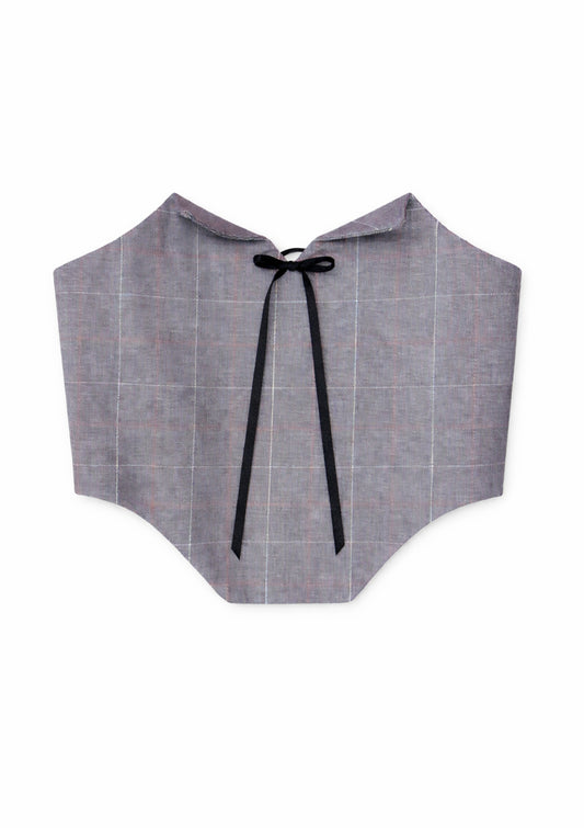 This handmade corset is crafted from a soft grey check fabric, designed to shape and define the waist with a structured yet elegant silhouette. Featuring a lace-up front with metal eyelets and black ribbon ties, it allows for adjustable fit and comfortable wear. The pointed hem adds a flattering, vintage-inspired touch, while the clean back finish keeps the look refined.