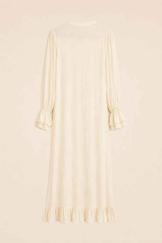 A cream-colored long-sleeve midi dress with ruffled cuffs and a ruffled hem, shown from the back against a solid beige background.