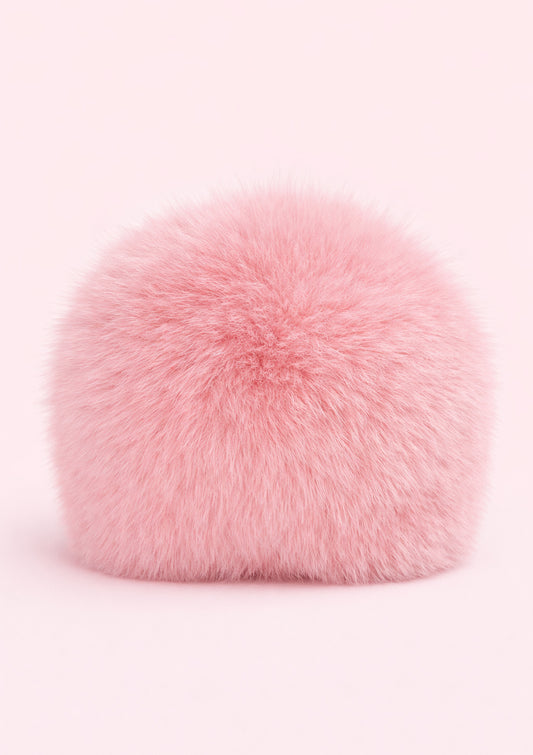 Pink fur hat on a white background