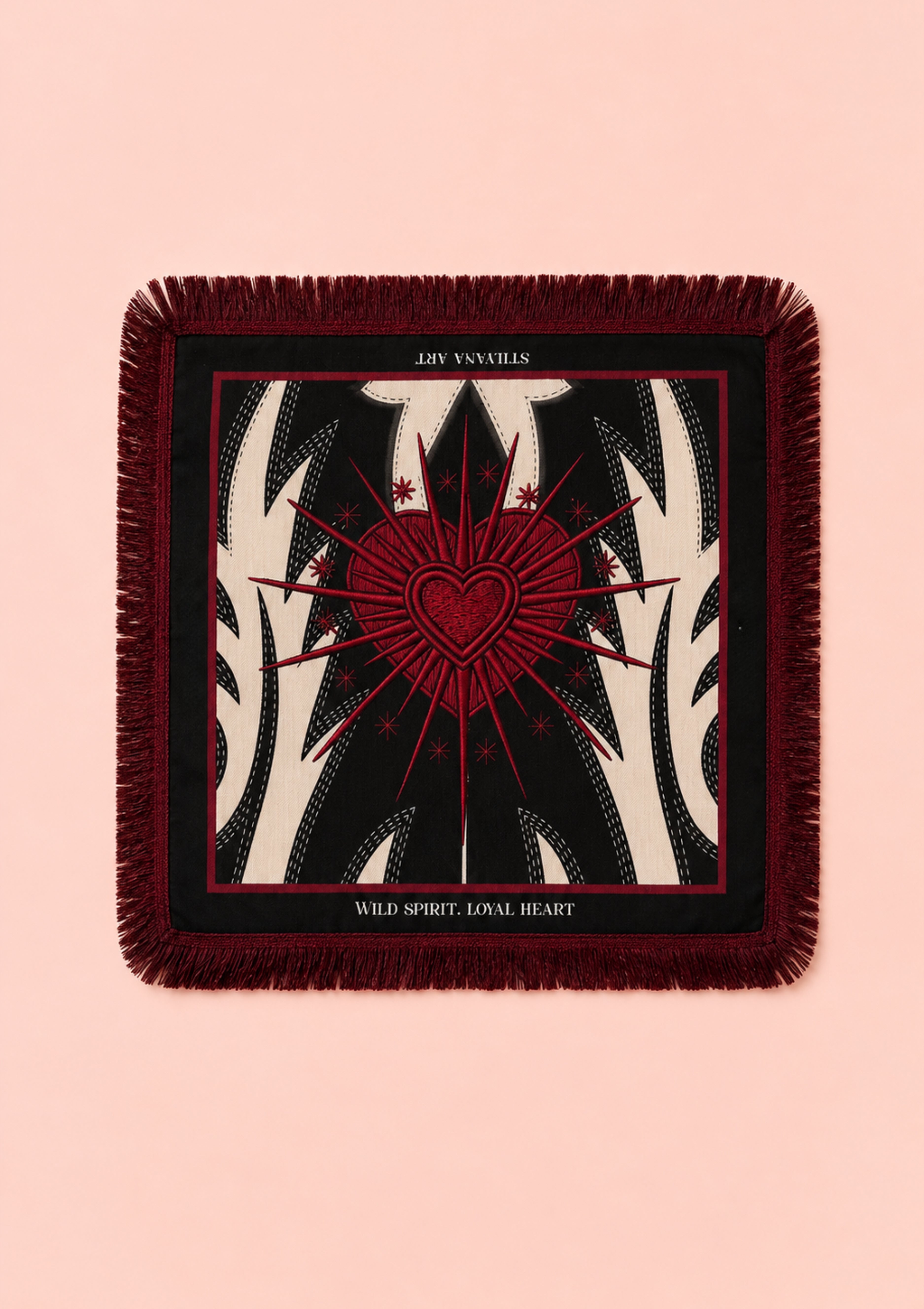 A square throw scarf with fringe edges, featuring a tarot card design of the 'Joy of Loves' card. The design has a dark red central heart and radiating lines over a black and cream zebra-stripe pattern, set against a solid pale pink background.
