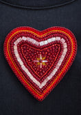Заредете изображението в програмата за преглед на галерия, Red heart-shaped patch with beadwork on a dark background
